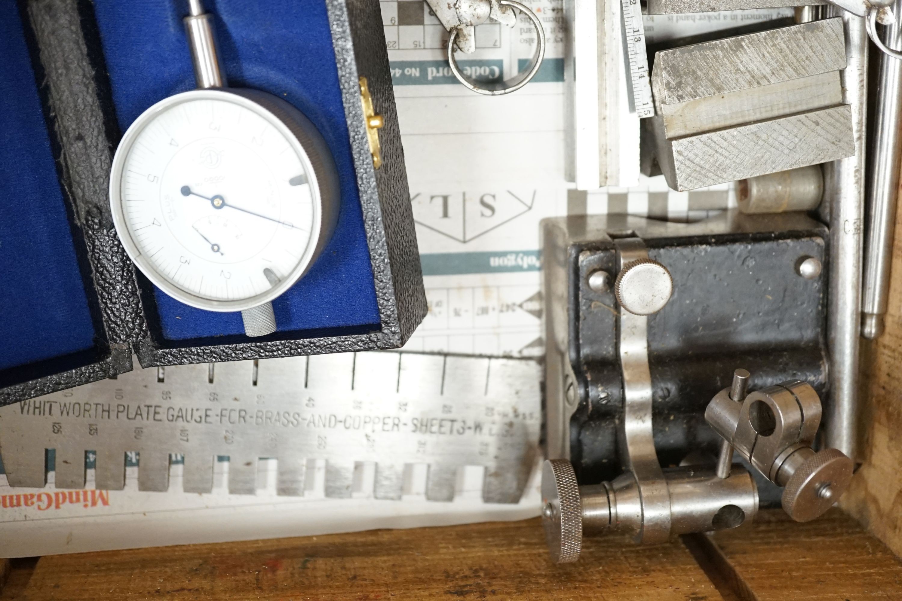 A collection of 20th century high precision metal measuring devices, including callipers, Compac dial micrometers, feeler gauges, wire gauges, a set square, steel cutting wheels etc